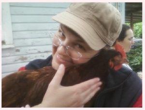 Woman hugging chicken